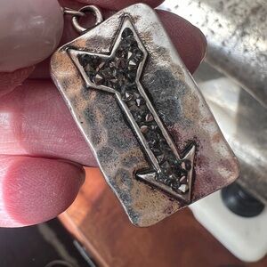 Crystal and silver arrow earrings.